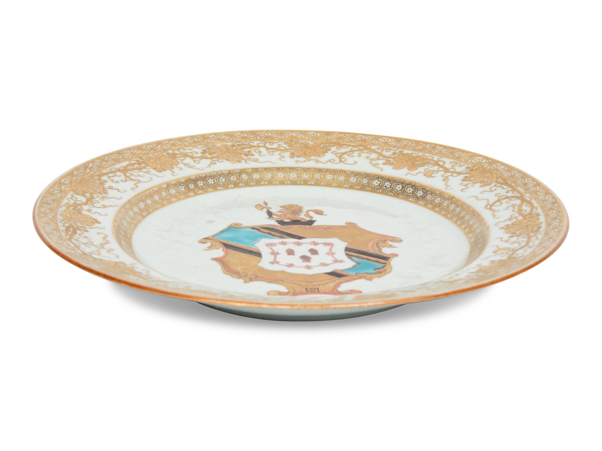 A Chinese Export Porcelain Parcel-Gilt Armorial Plate