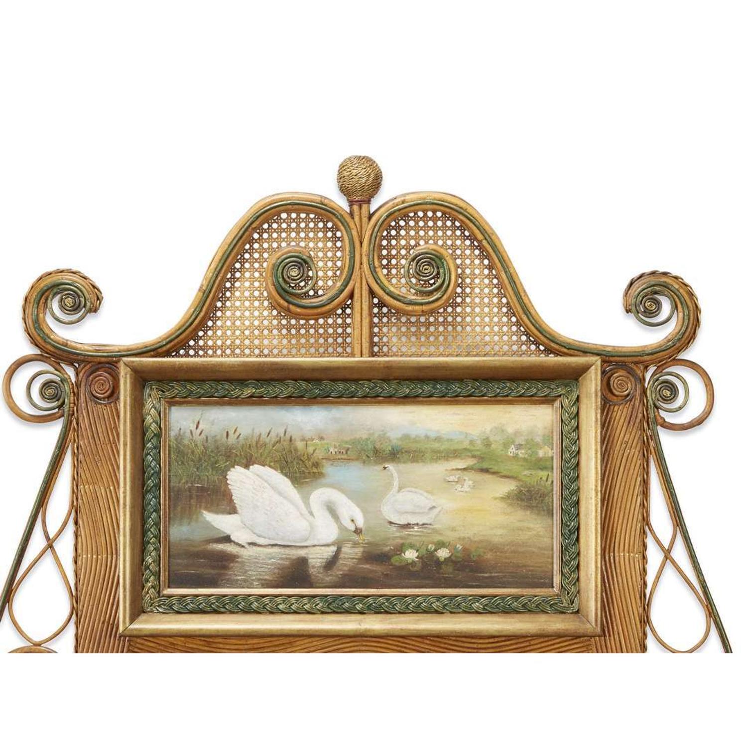 A large polychrome painted rattan and cane mirror with swans american, circa 1900