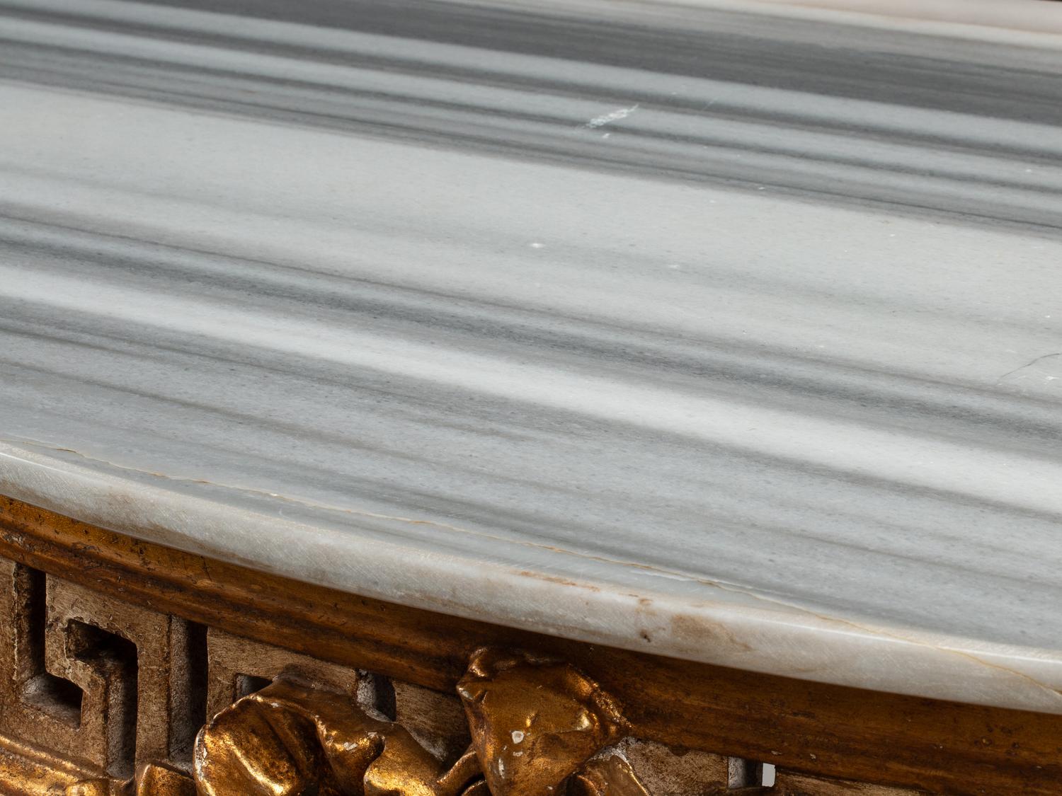 A Pair of Italian Neoclassical Style White Painted and Parcel Gilt Marble-Top Console Tables