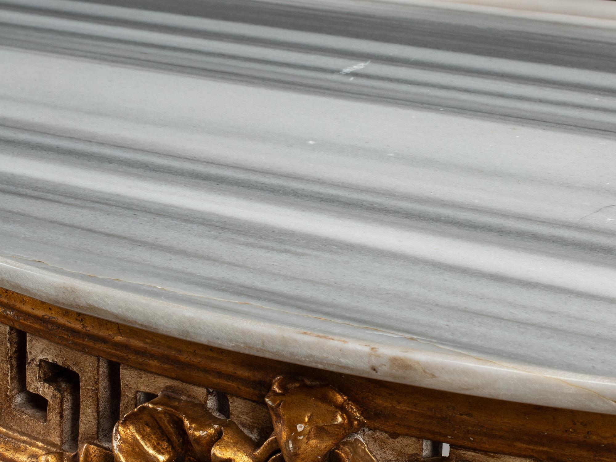 A Pair of Italian Neoclassical Style White Painted and Parcel Gilt Marble-Top Console Tables