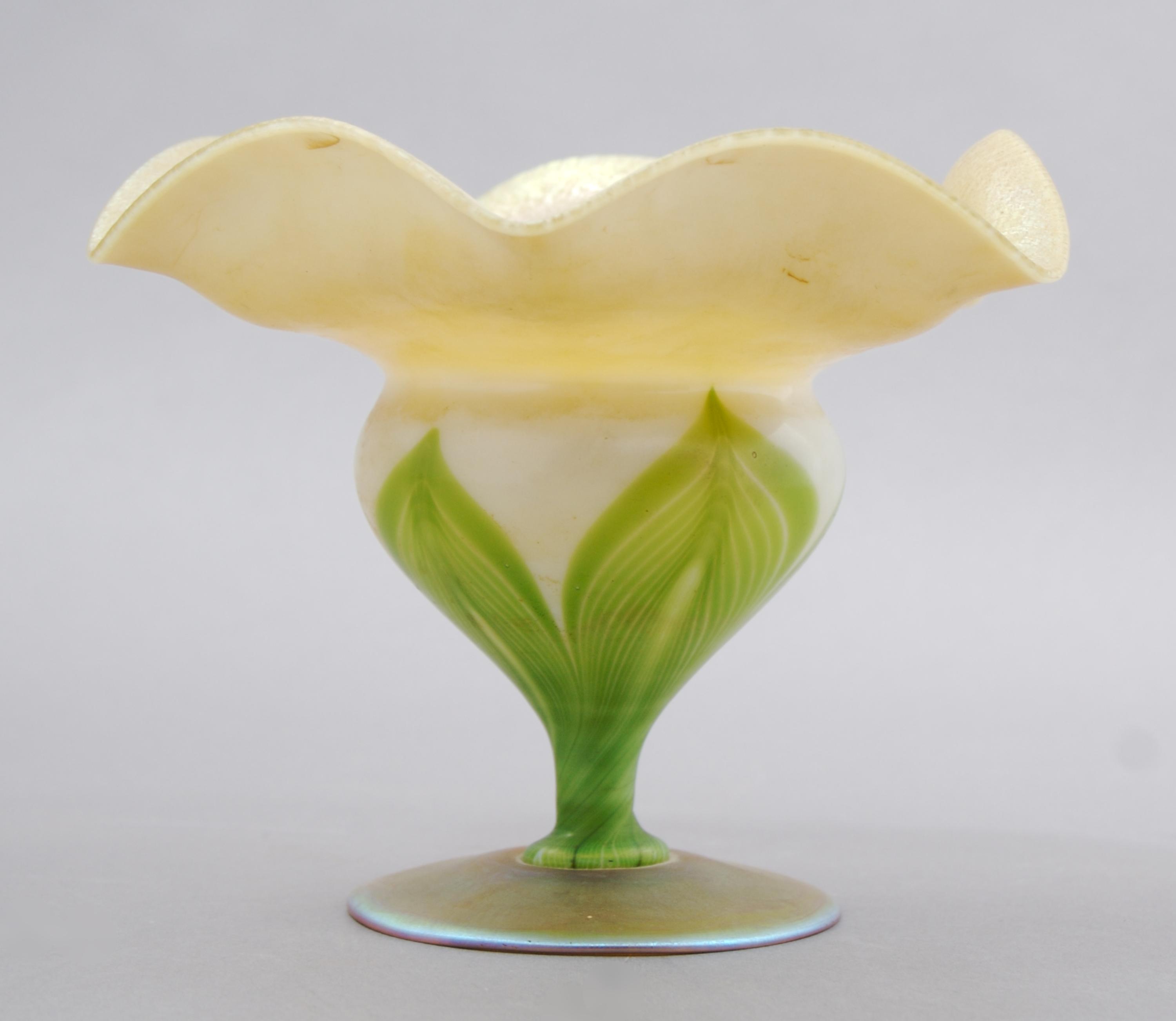 A Tiffany Favrile Glass Floriform Vase, Height 4 1/2 inches.