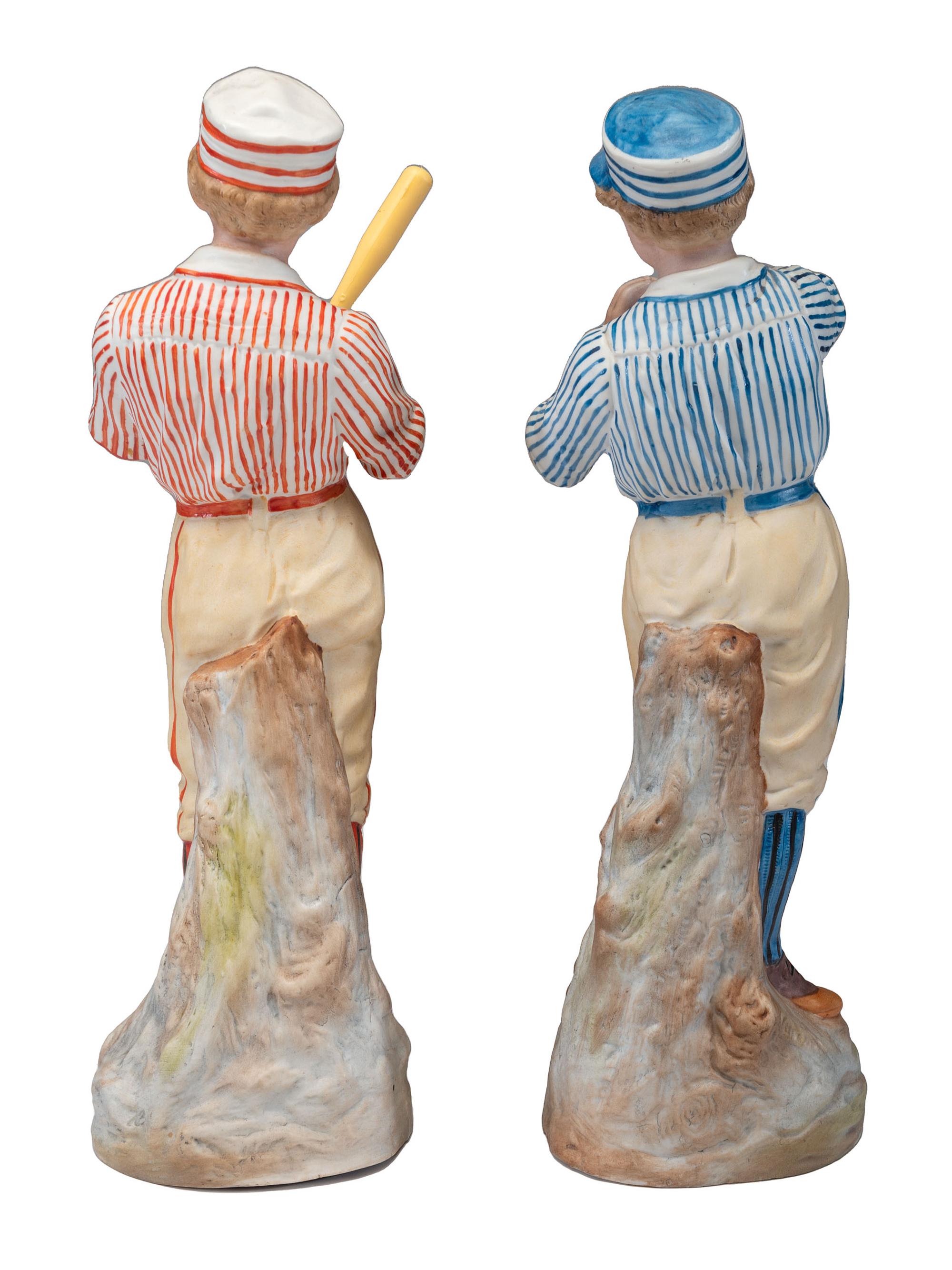 A Pair of German Bisque Porcelain Baseball Figures