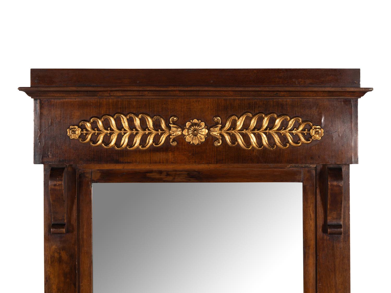 An Empire Walnut and Parcel Gilt Mirror