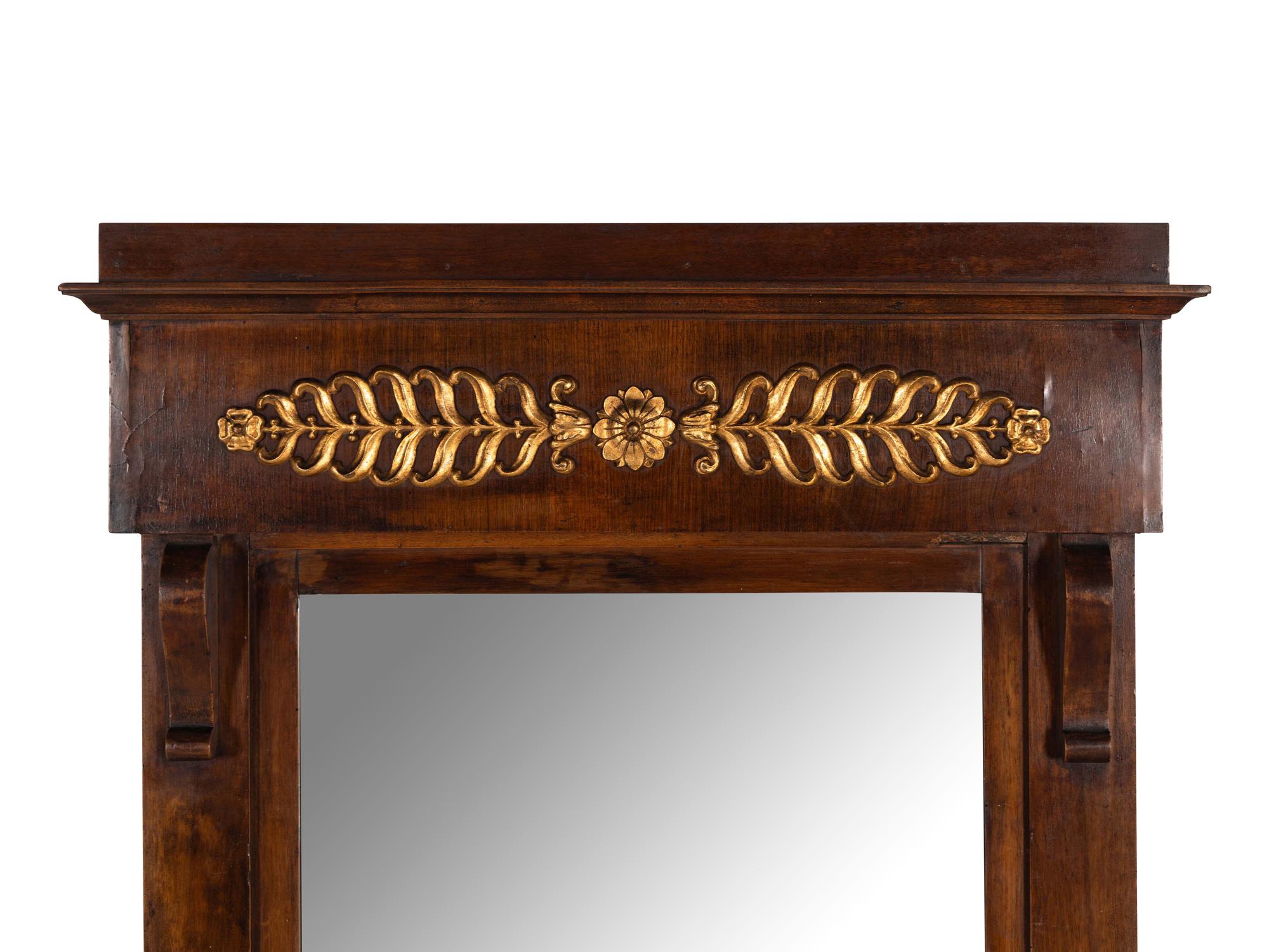 An Empire Walnut and Parcel Gilt Mirror