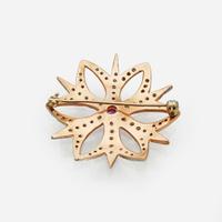 A 10K Rose Gold, Diamond, and Ruby Brooch