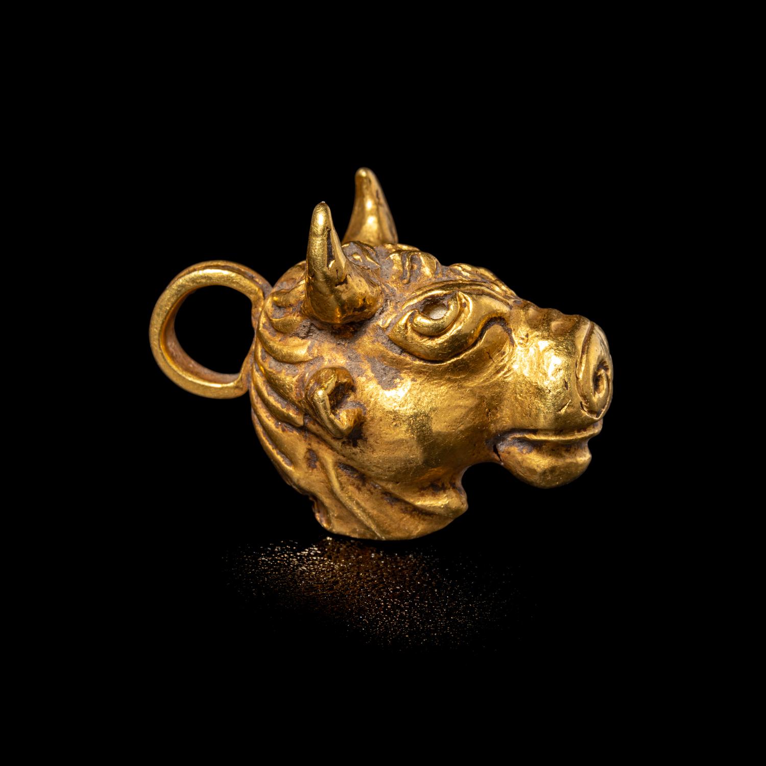 A Roman Gold Bull Pendant
