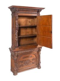 An Italian Renaissance Revival Carved Oak Cabinet