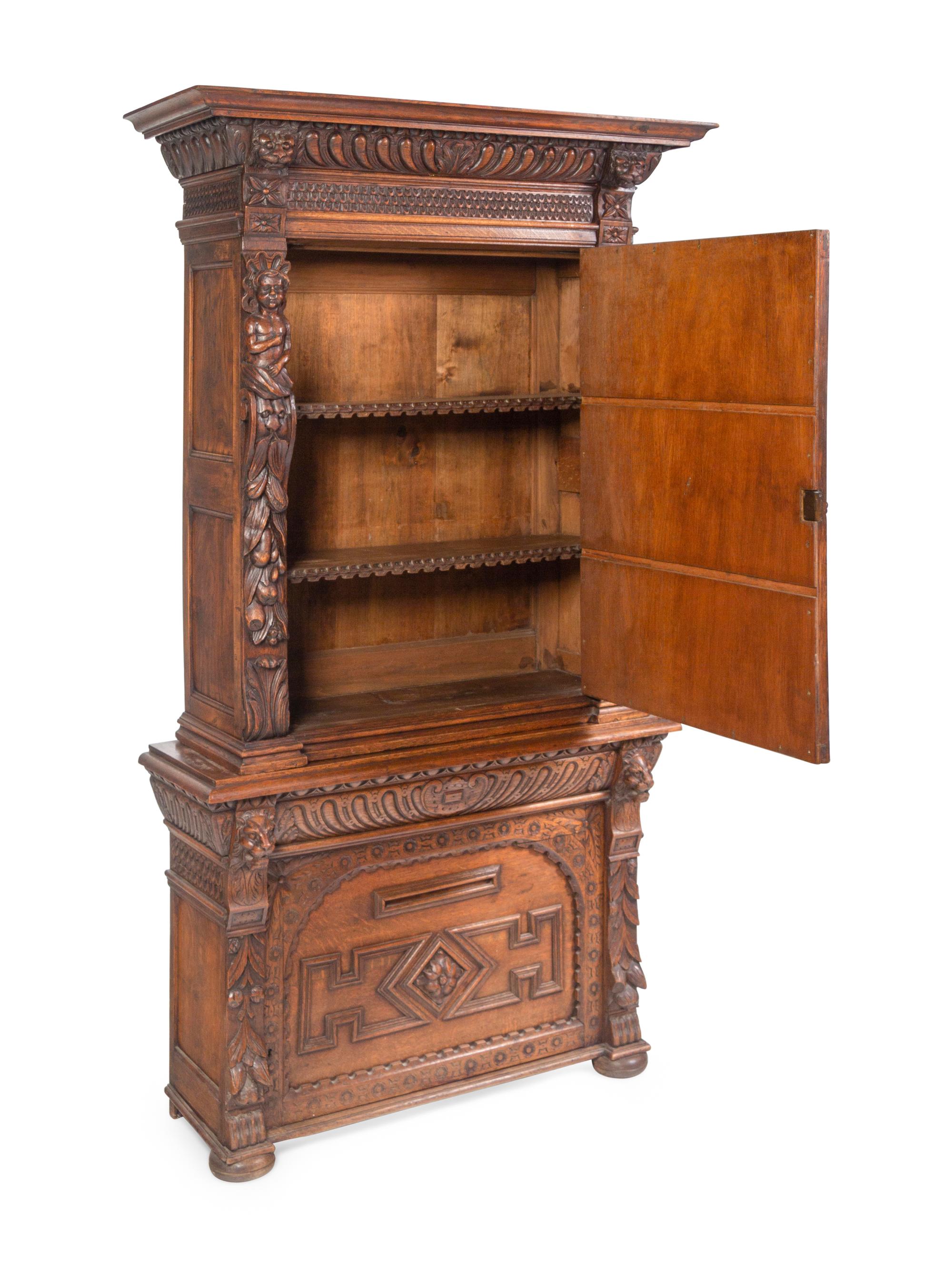 An Italian Renaissance Revival Carved Oak Cabinet