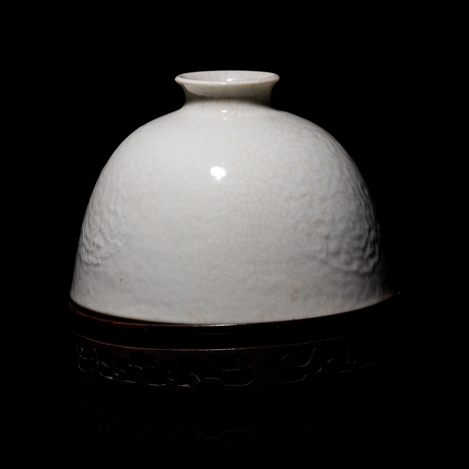 A Chinese White Glazed Soft Paste Porcelain Beehive Water Pot, 18th/19th Century 清中期 白釉暗團花太白尊