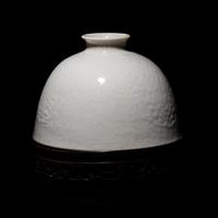 A Chinese White Glazed Soft Paste Porcelain Beehive Water Pot, 18th/19th Century 清中期 白釉暗團花太白尊