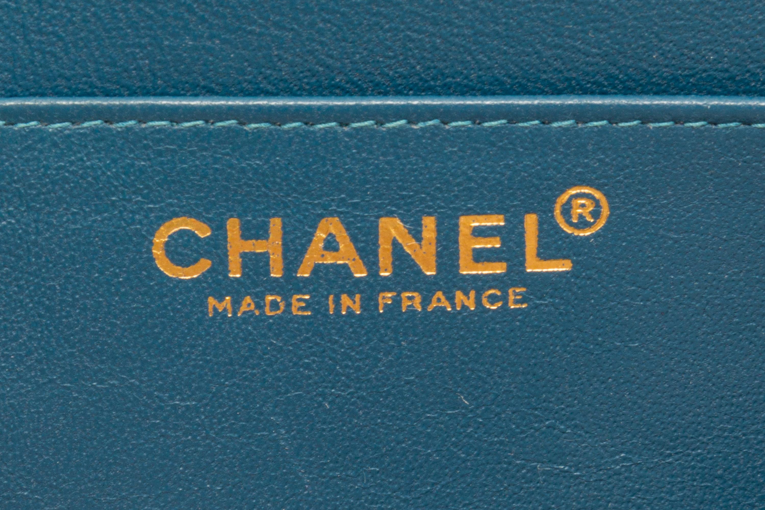 A Chanel Blue Calfskin Leather Accordian Flap Handbag, 9" x 5" x 4".
