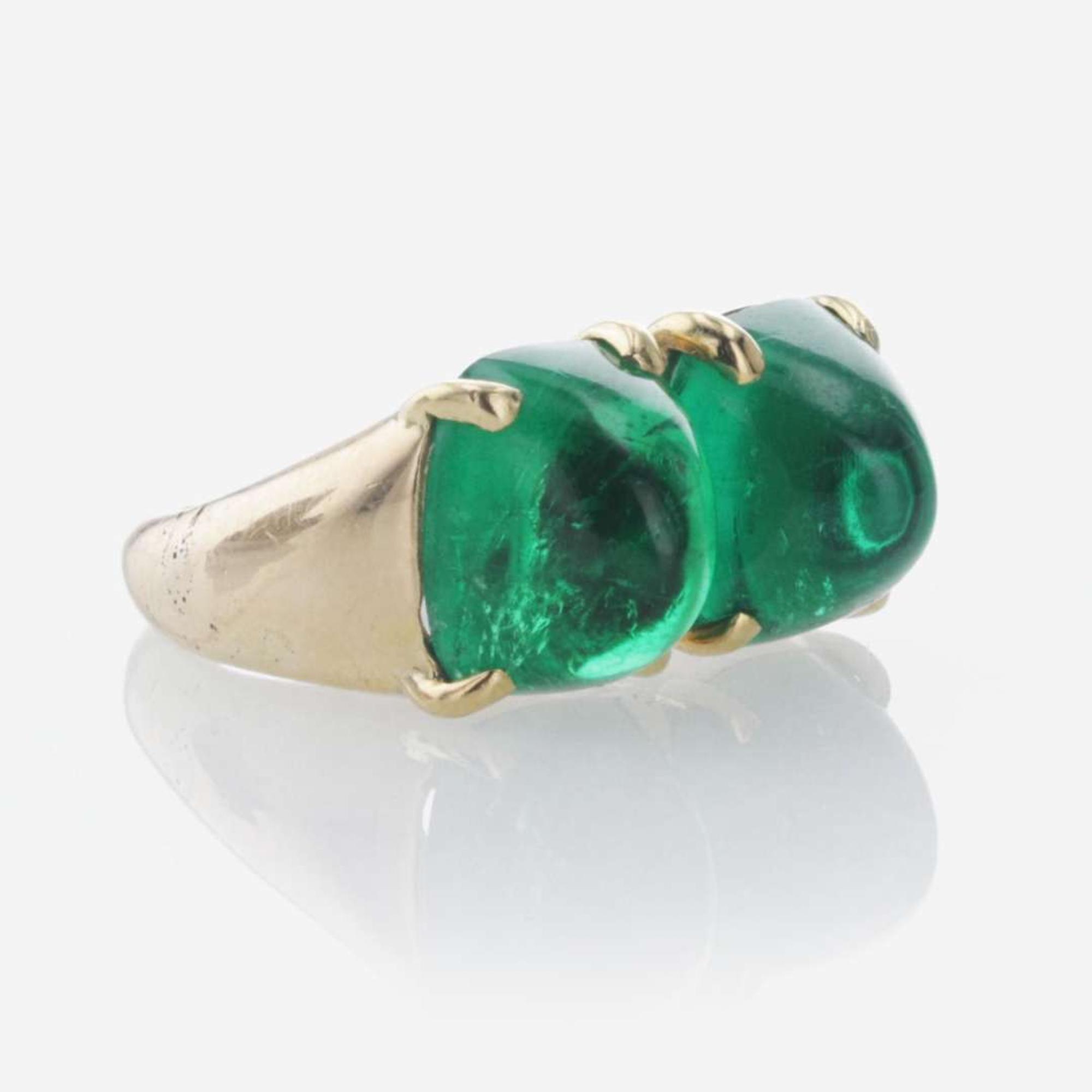 A Yellow Gold and Sugarloaf Emerald Ring