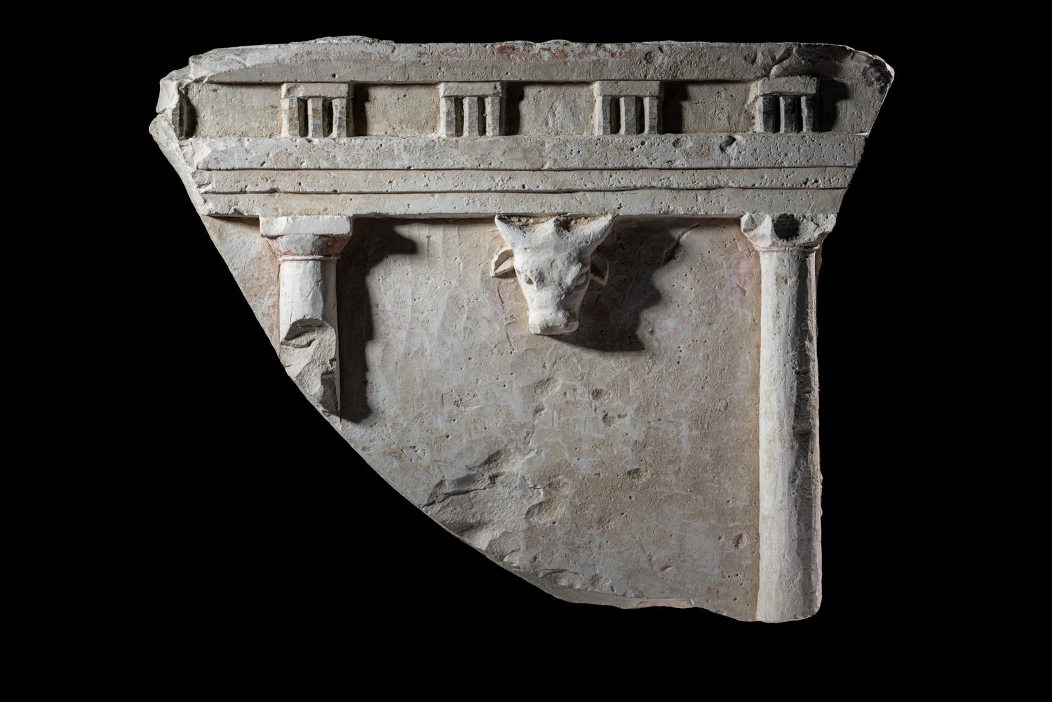 A Greco-Roman Limestone Fragment with Entablature and Bucranium