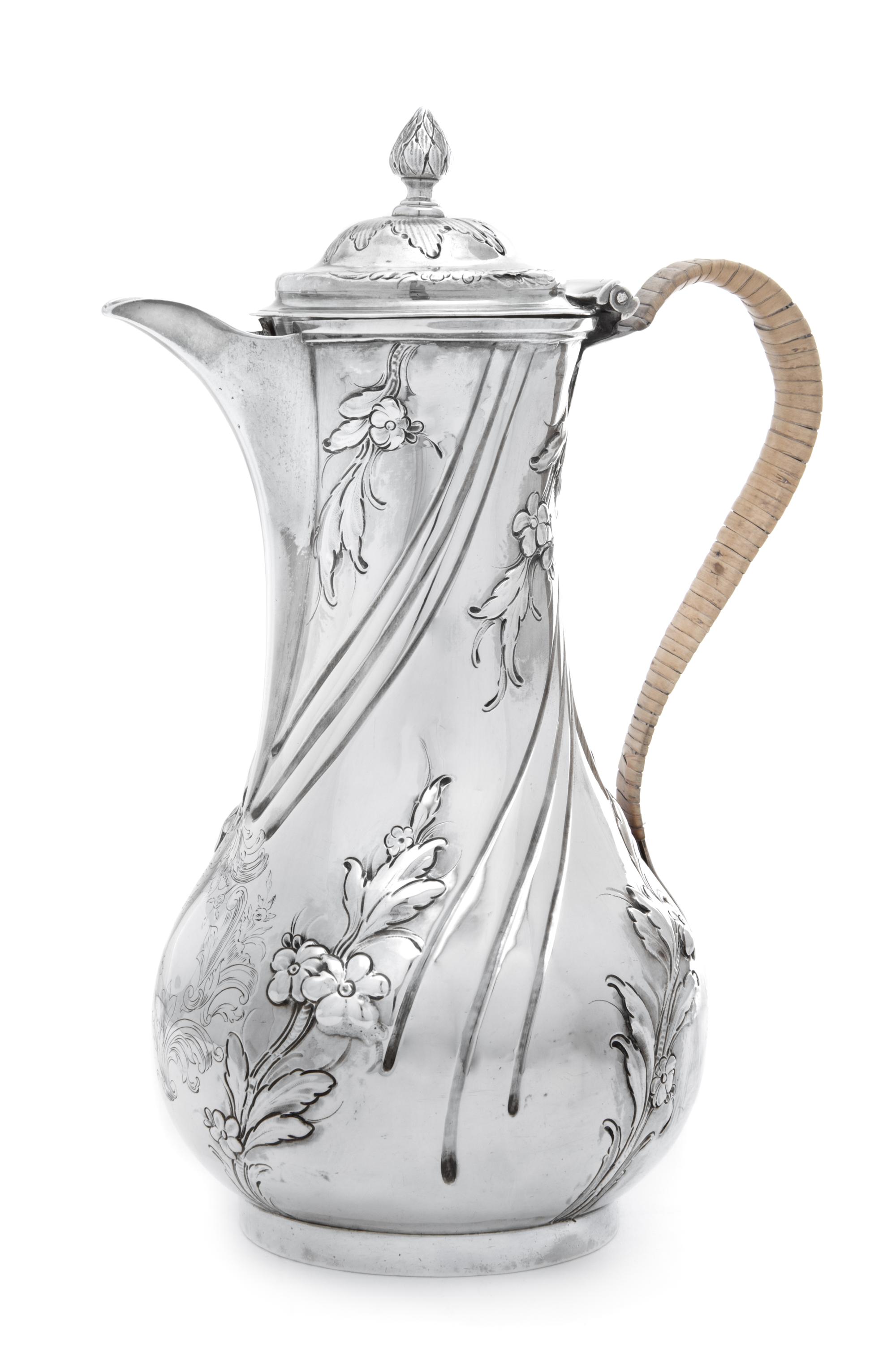 A George II Silver Coffee Pot, Thomas Whipham & Chas. Wright London, 1757, of twisted baluster form, the body worked with floral and fo