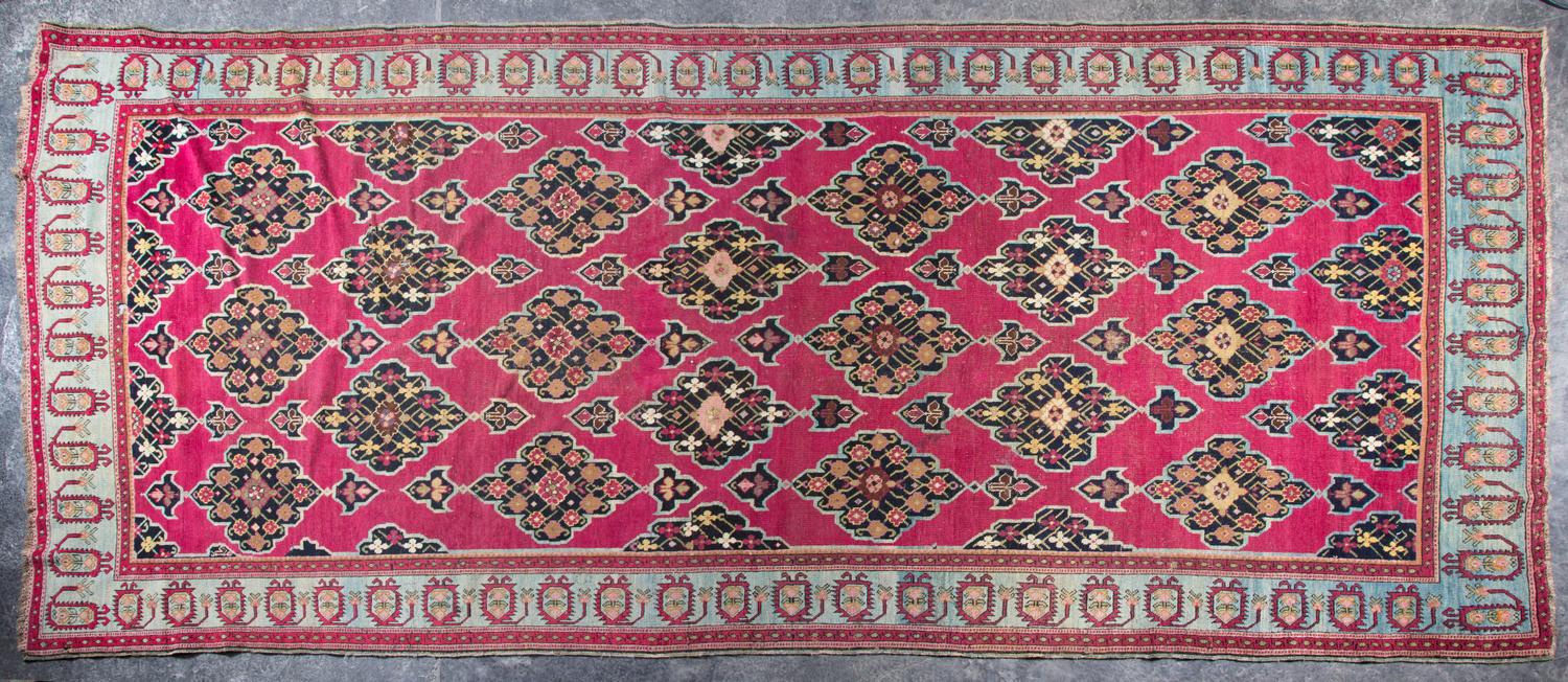 A Wool Rug 12 feet 3 inches x 5 feet 4 inches.