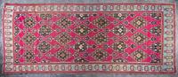 A Wool Rug 12 feet 3 inches x 5 feet 4 inches.