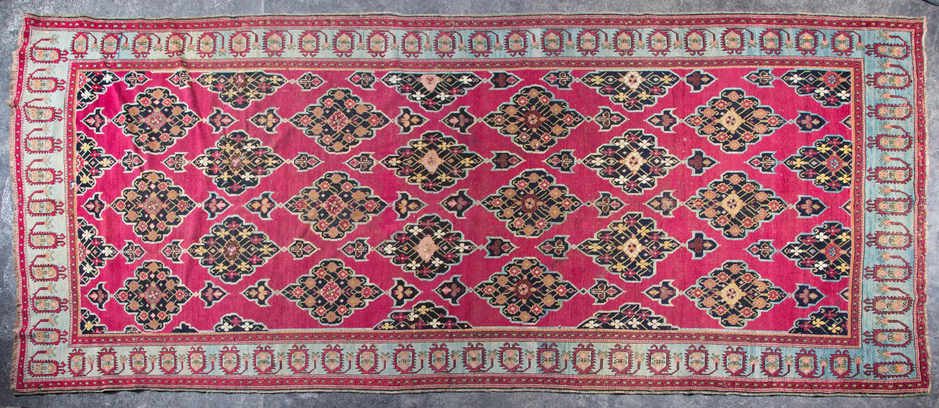 A Wool Rug 12 feet 3 inches x 5 feet 4 inches.