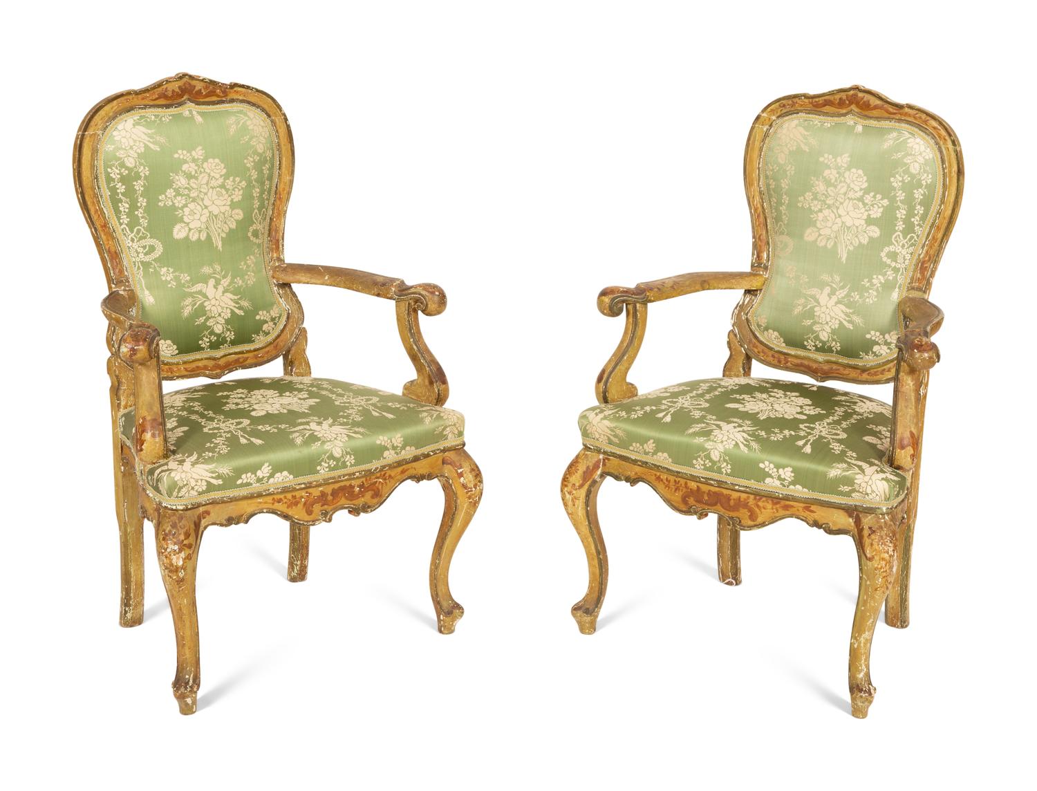 A Pair of Italian Painted and Parcel Gilt Open Armchairs