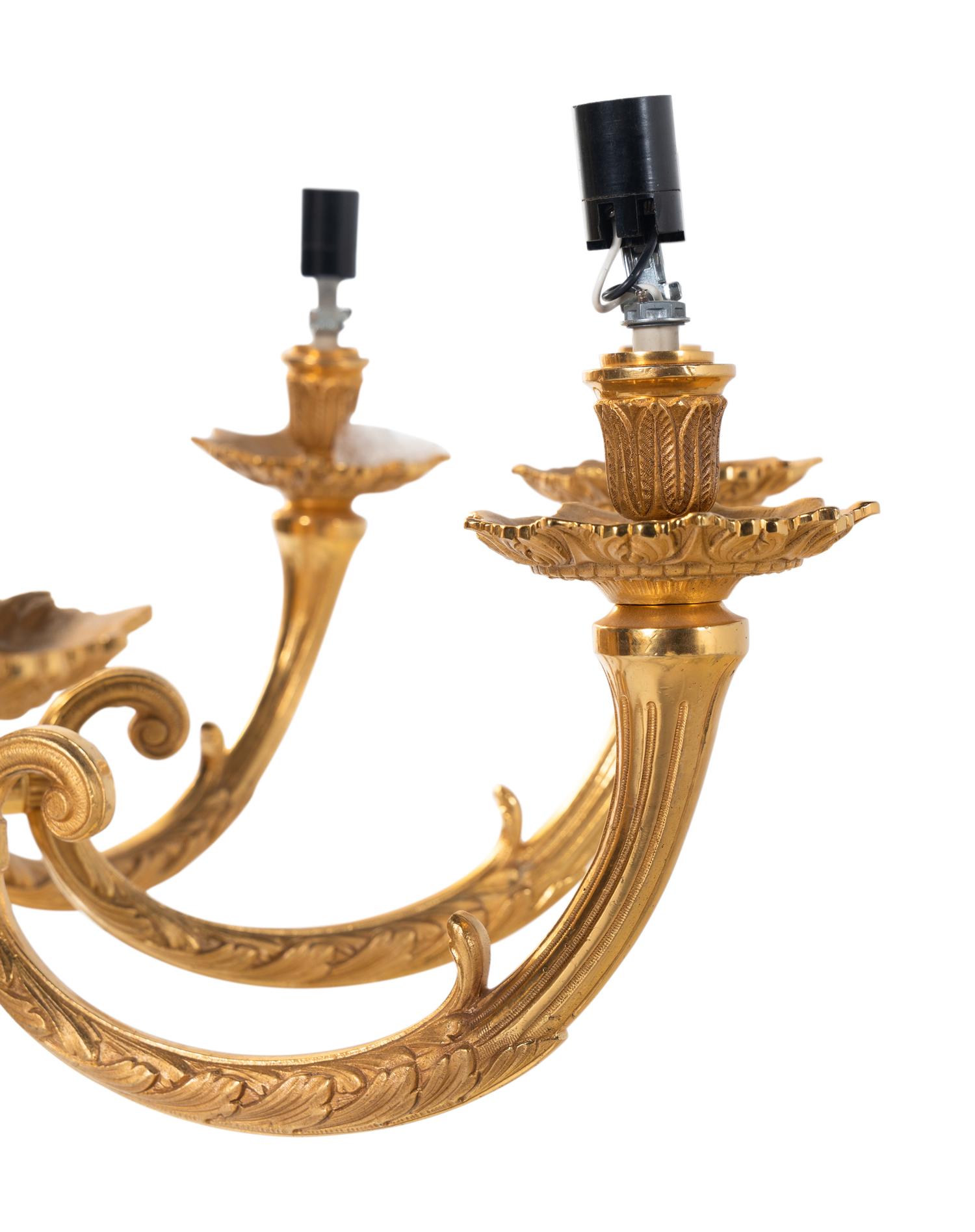 A Pair of Empire Style Gilt Bronze Nine-Light Chandeliers