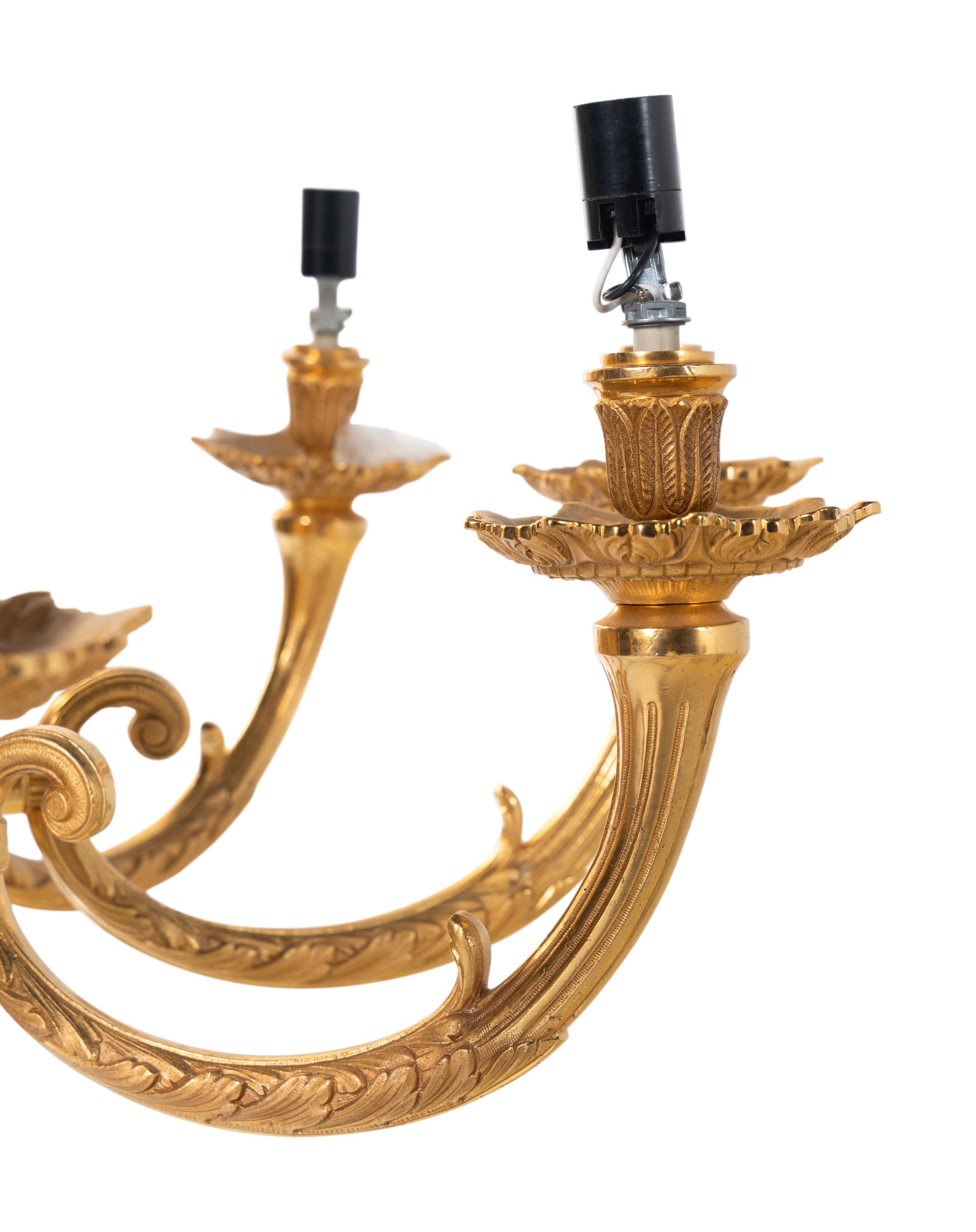 A Pair of Empire Style Gilt Bronze Nine-Light Chandeliers
