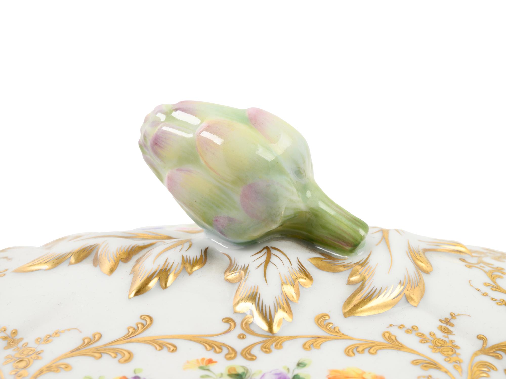 A French Parcel Gilt and Hand Painted Porcelain Tureen