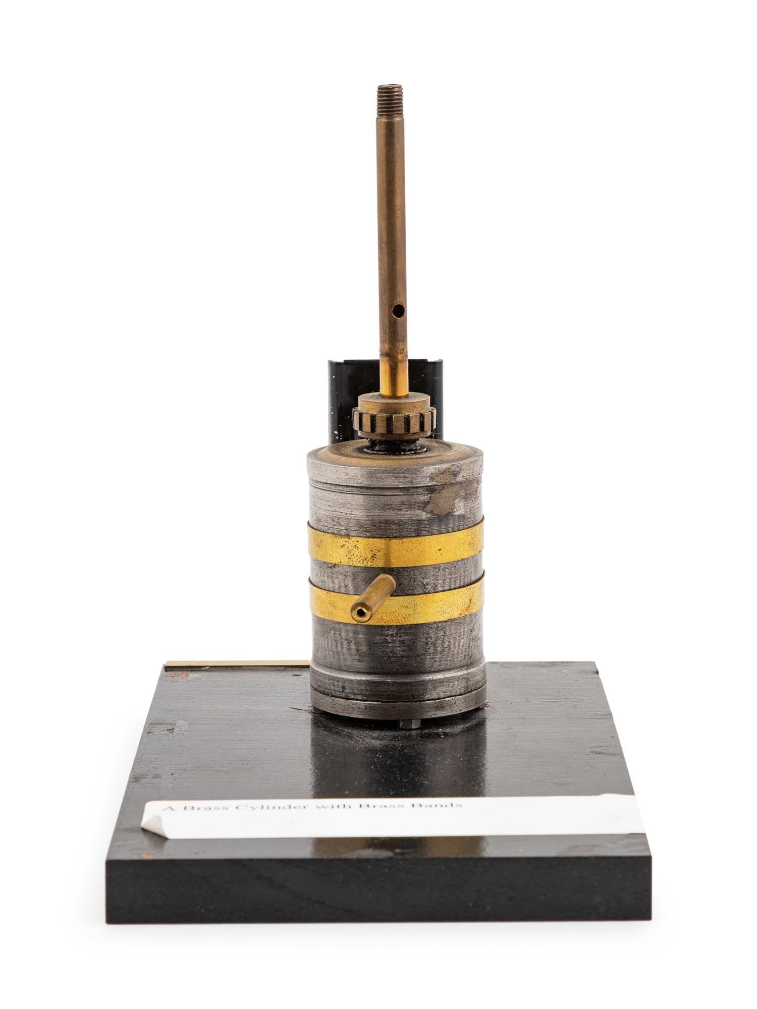 A Brass Banded Metal Engine Cylinder Demonstration Model