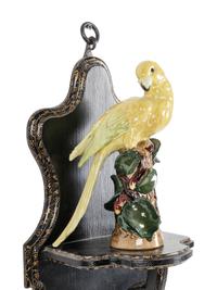 A Pair of Continental Porcelain Parrots with Parcel Gilt and Ebonized Wall Brackets
