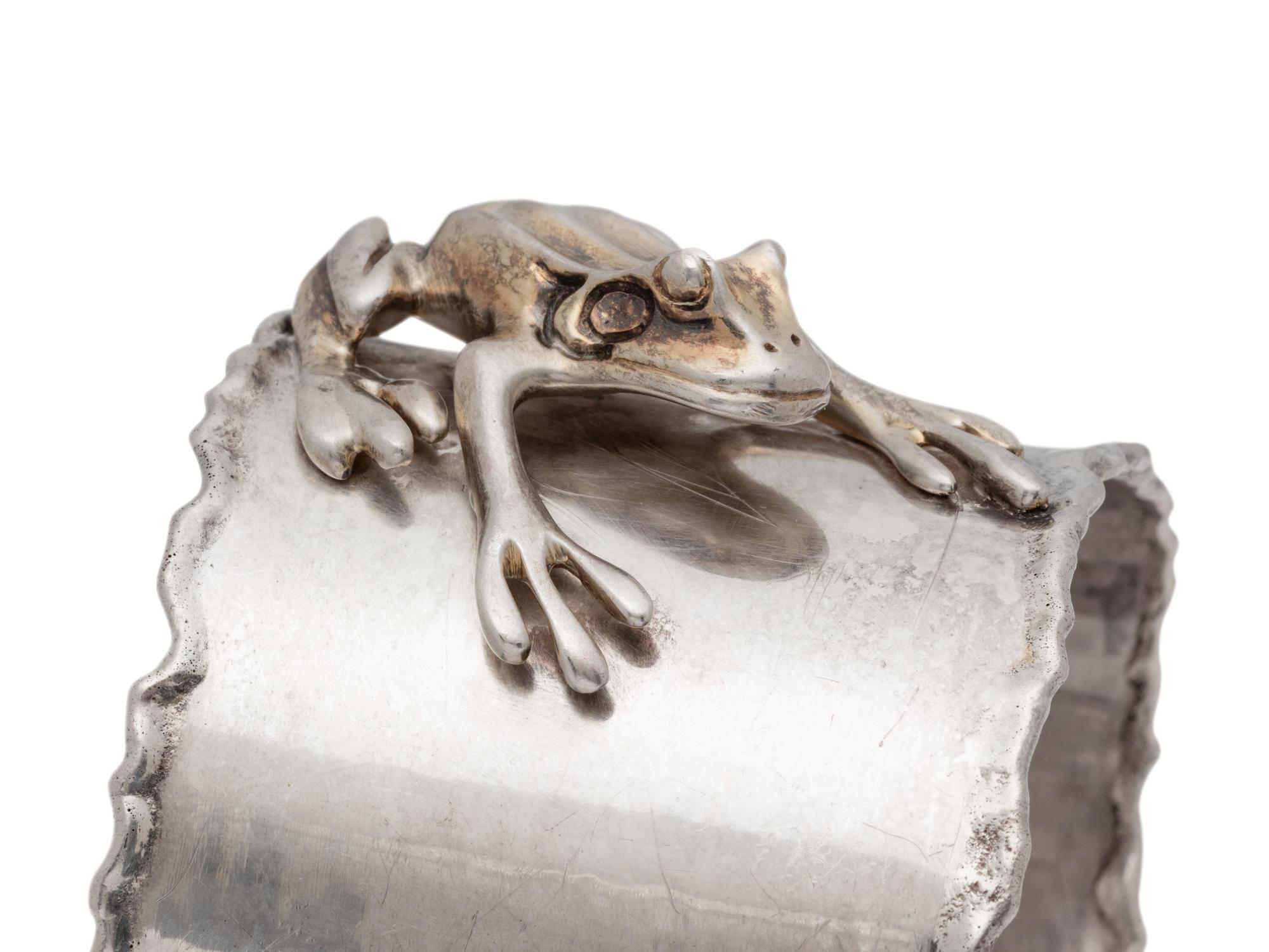 A Collection of Silver Frog Bracelets,