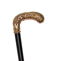 An American Presentation 14 Karat Gold Handled Cane, Length of handle 5 x length overall 34 inches.