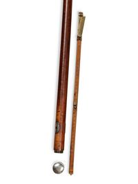 A Silvered Metal Mounted Malacca Bootmaker's 'System' Walking Stick