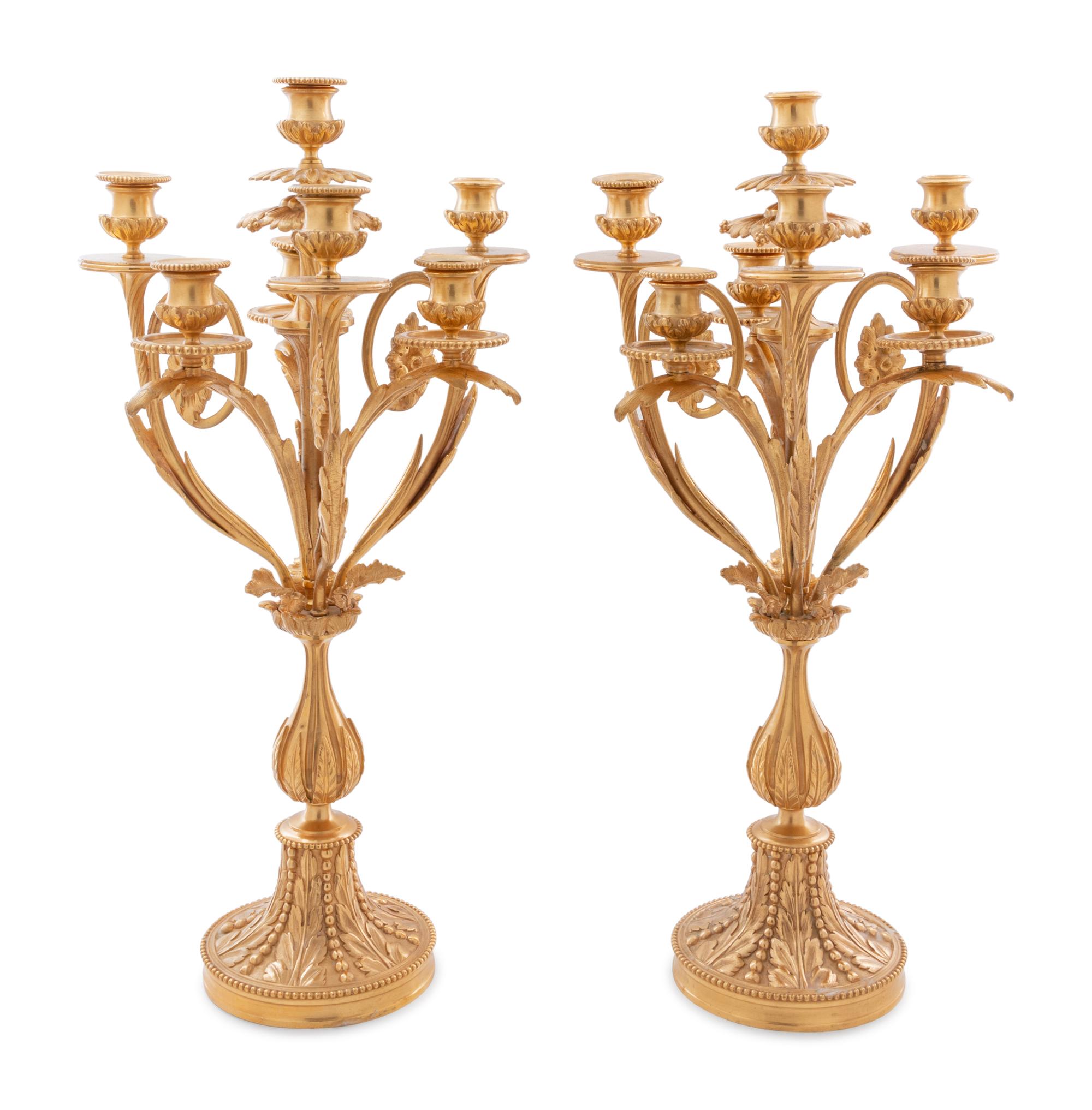 A Louis XV Style Gilt Bronze and Glass Table Garniture