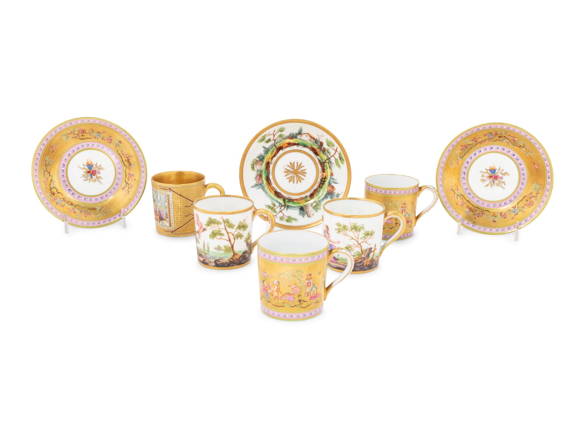A Group of French Painted Porcelain Coffee Cups and Saucers