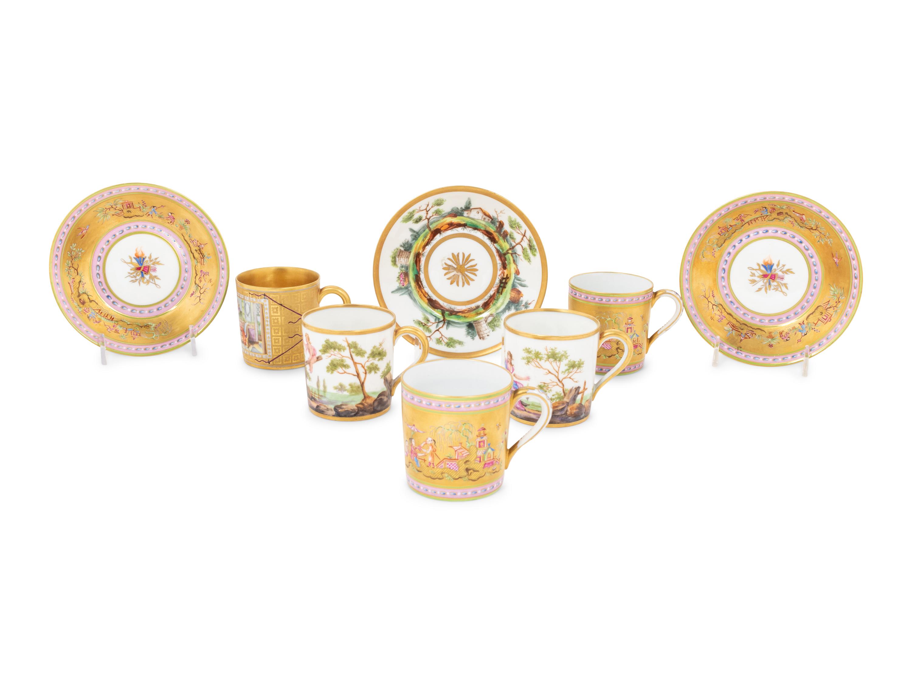 A Group of French Painted Porcelain Coffee Cups and Saucers