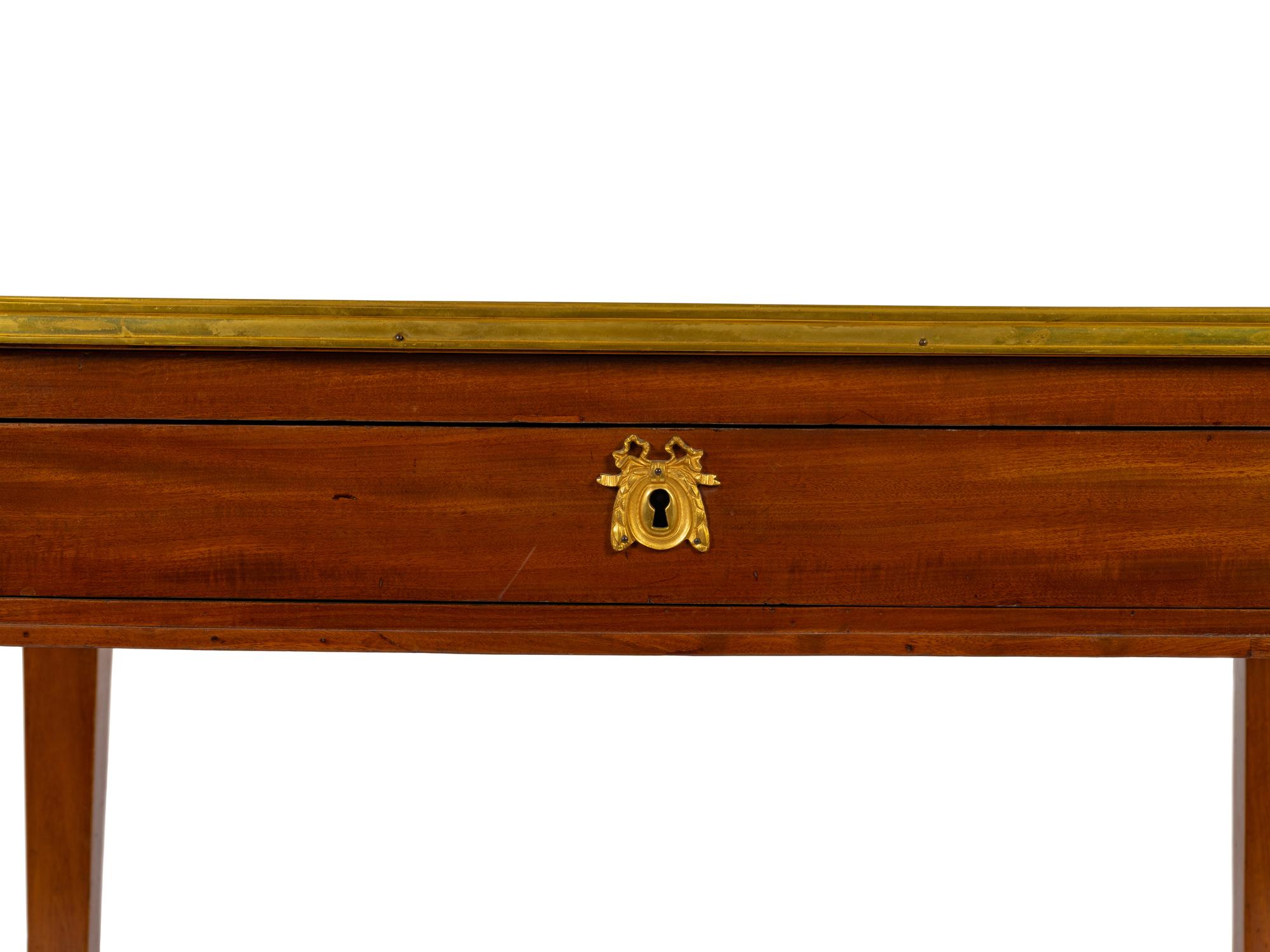 A Louis XVI Style Bronze Mounted Marble Top Writing Table — LATE 19TH CENTURY