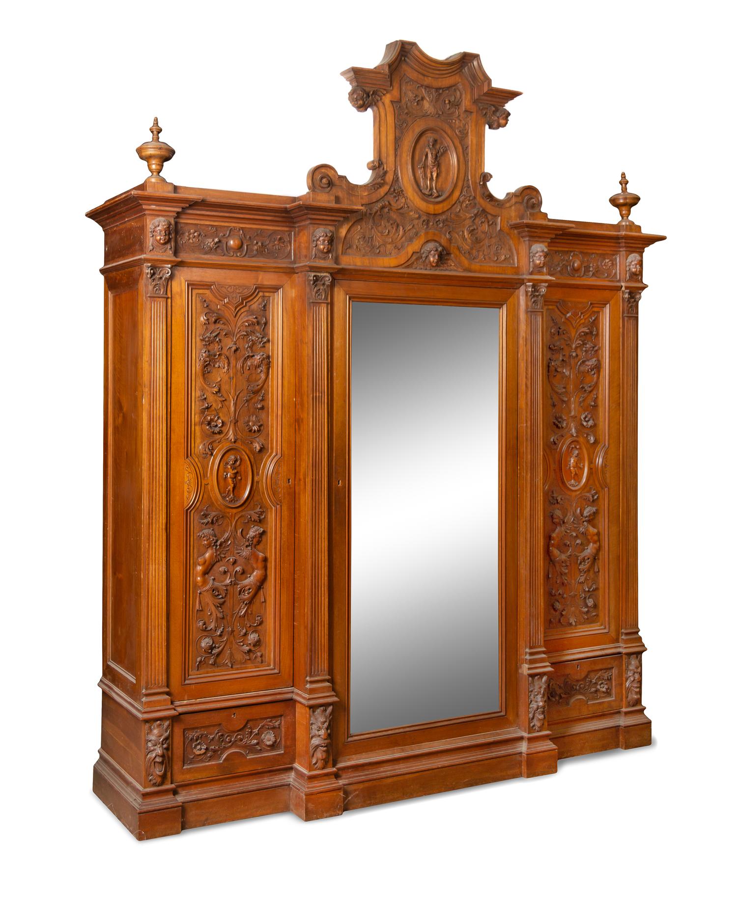 An Italian Renaissance Revival Carved Walnut Armoire