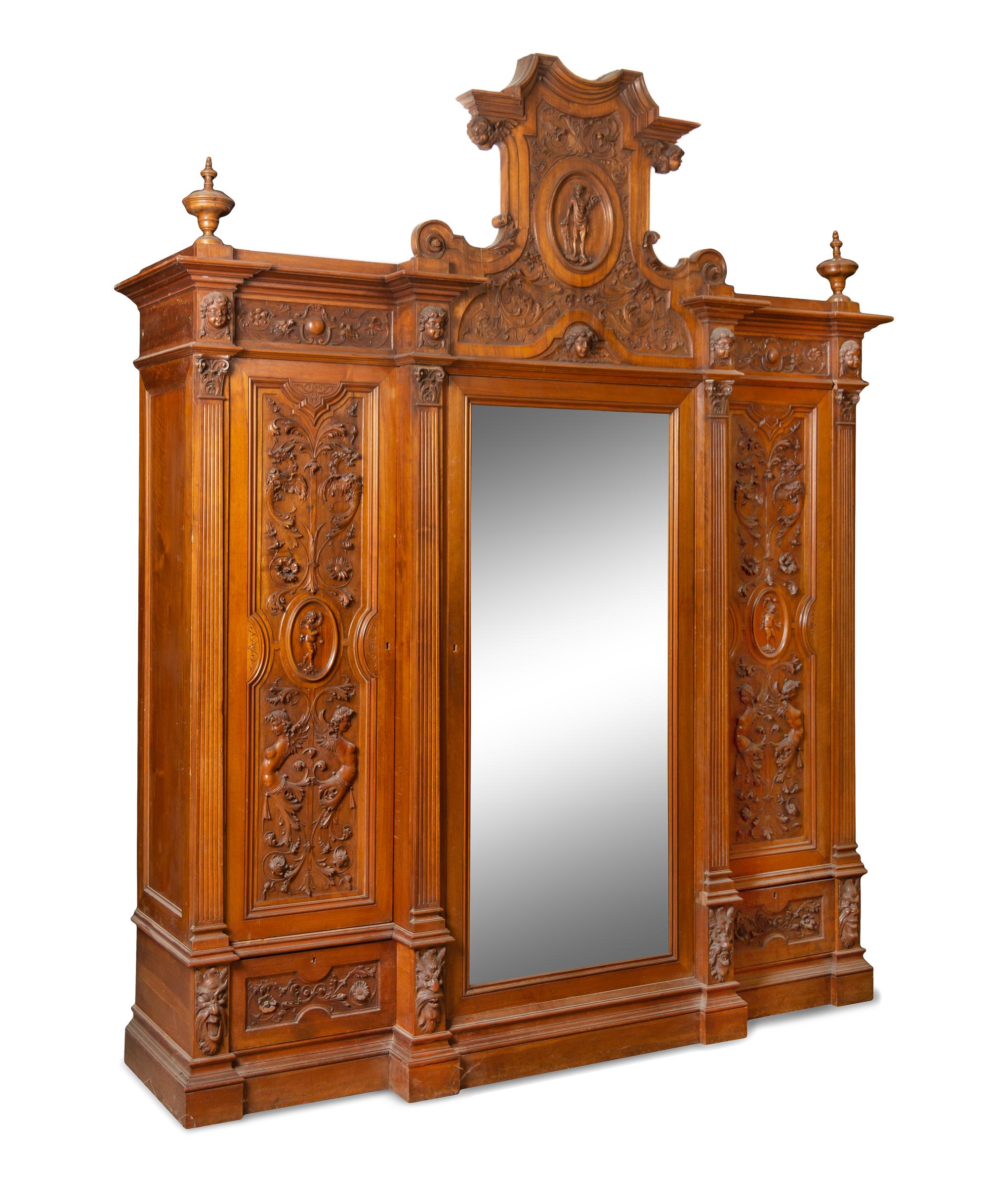 An Italian Renaissance Revival Carved Walnut Armoire