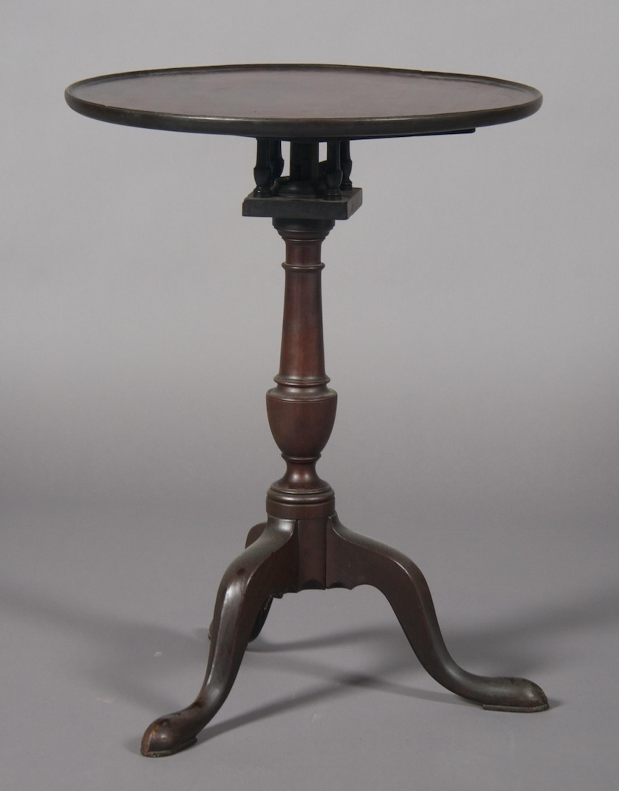 A Mahogany Tilt-Top Tea Table, Height 27 1/2 x width 21 1/2 x depth 21 1/2 inches.