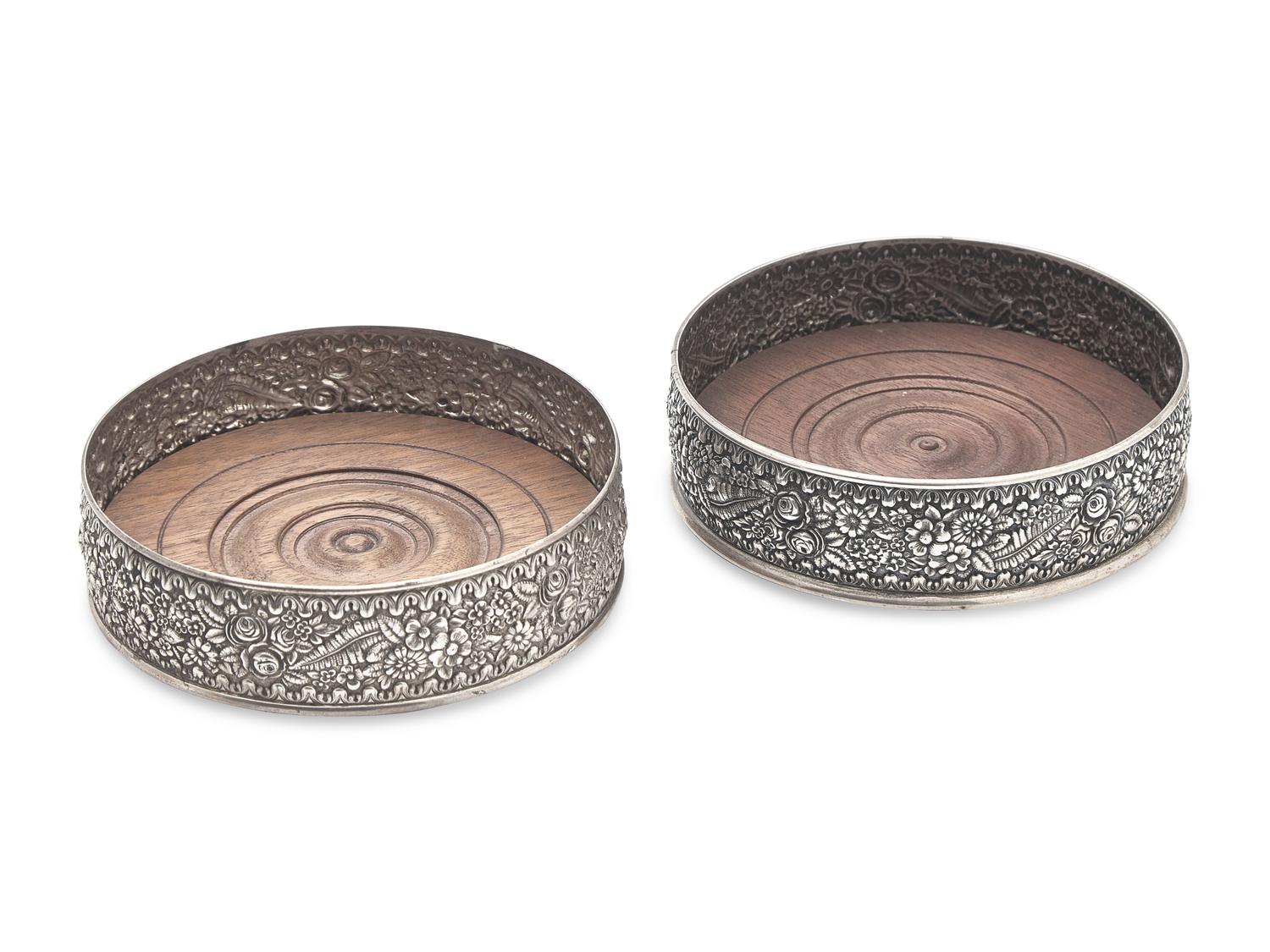 A Pair of Sterling Silver Floral Repousse Wine Coasters, Tiffany & Co., New York, NY, Circa 1880