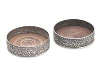 A Pair of Sterling Silver Floral Repousse Wine Coasters, Tiffany & Co., New York, NY, Circa 1880