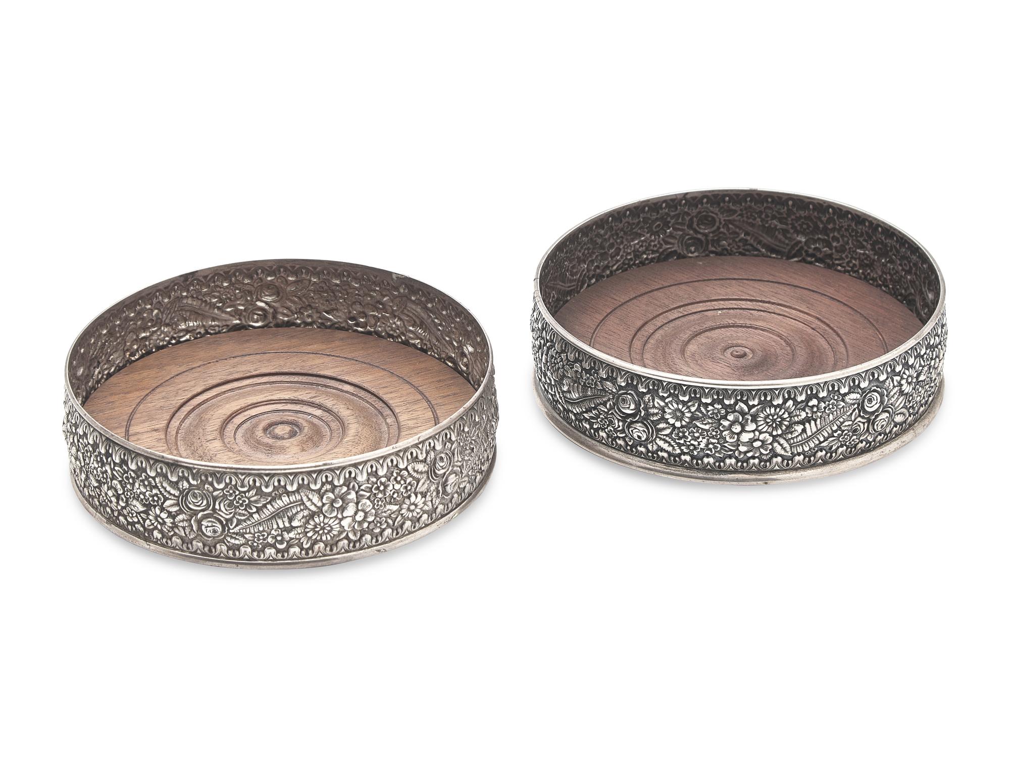 A Pair of Sterling Silver Floral Repousse Wine Coasters, Tiffany & Co., New York, NY, Circa 1880