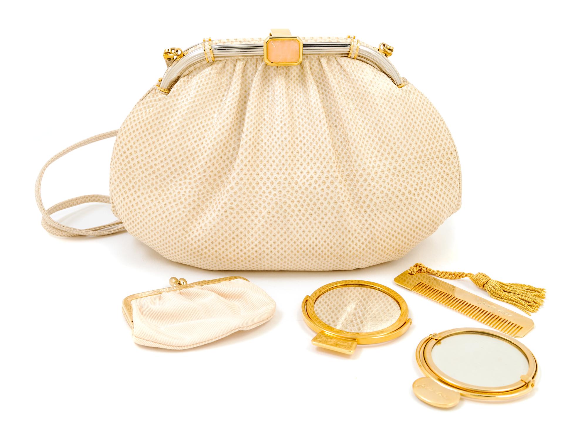 A Judith Leiber Ivory Snakeskin Clutch, 9.5" x 6" x 1.5".