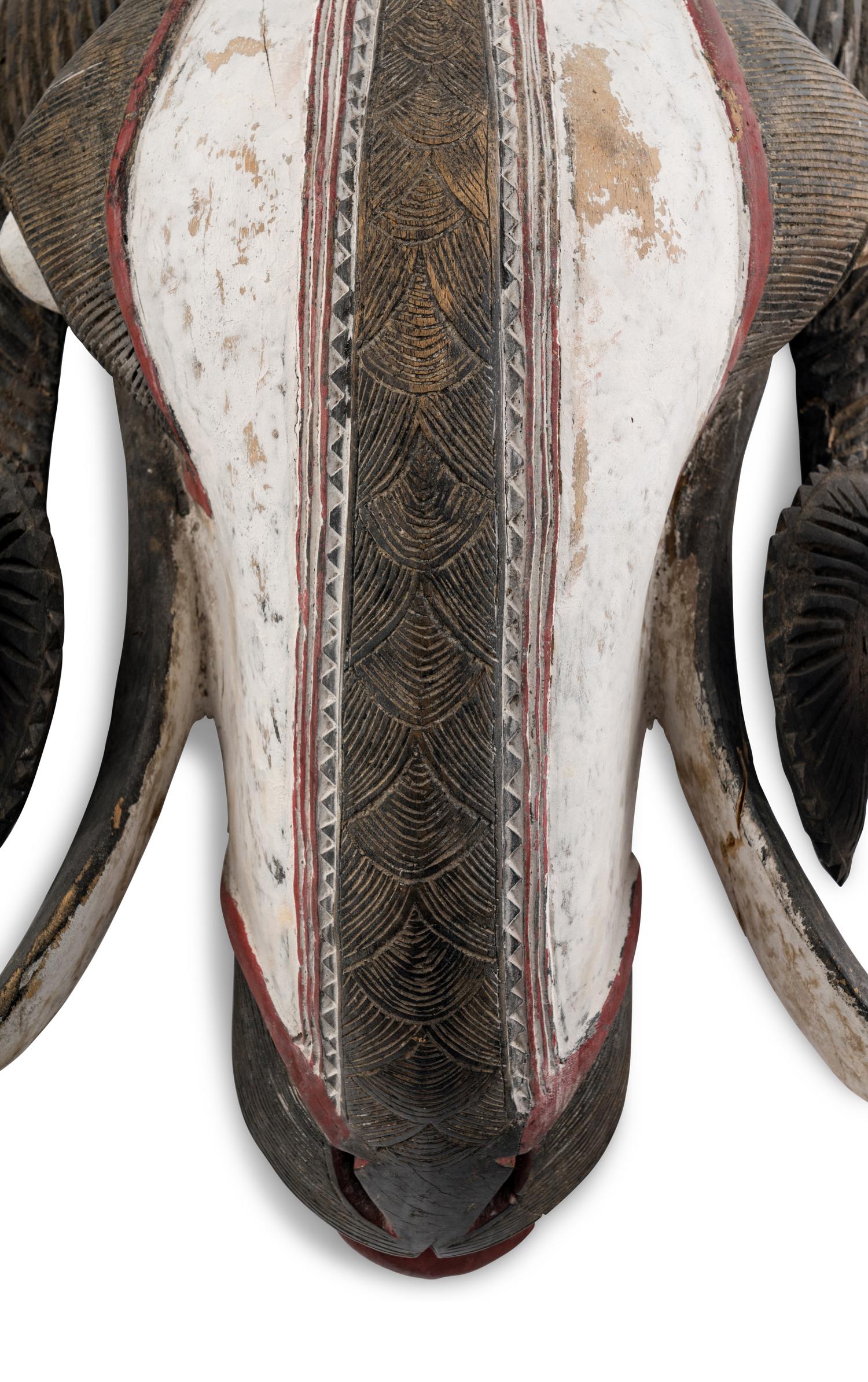 An African Carved and Painted Wood Ram's Head