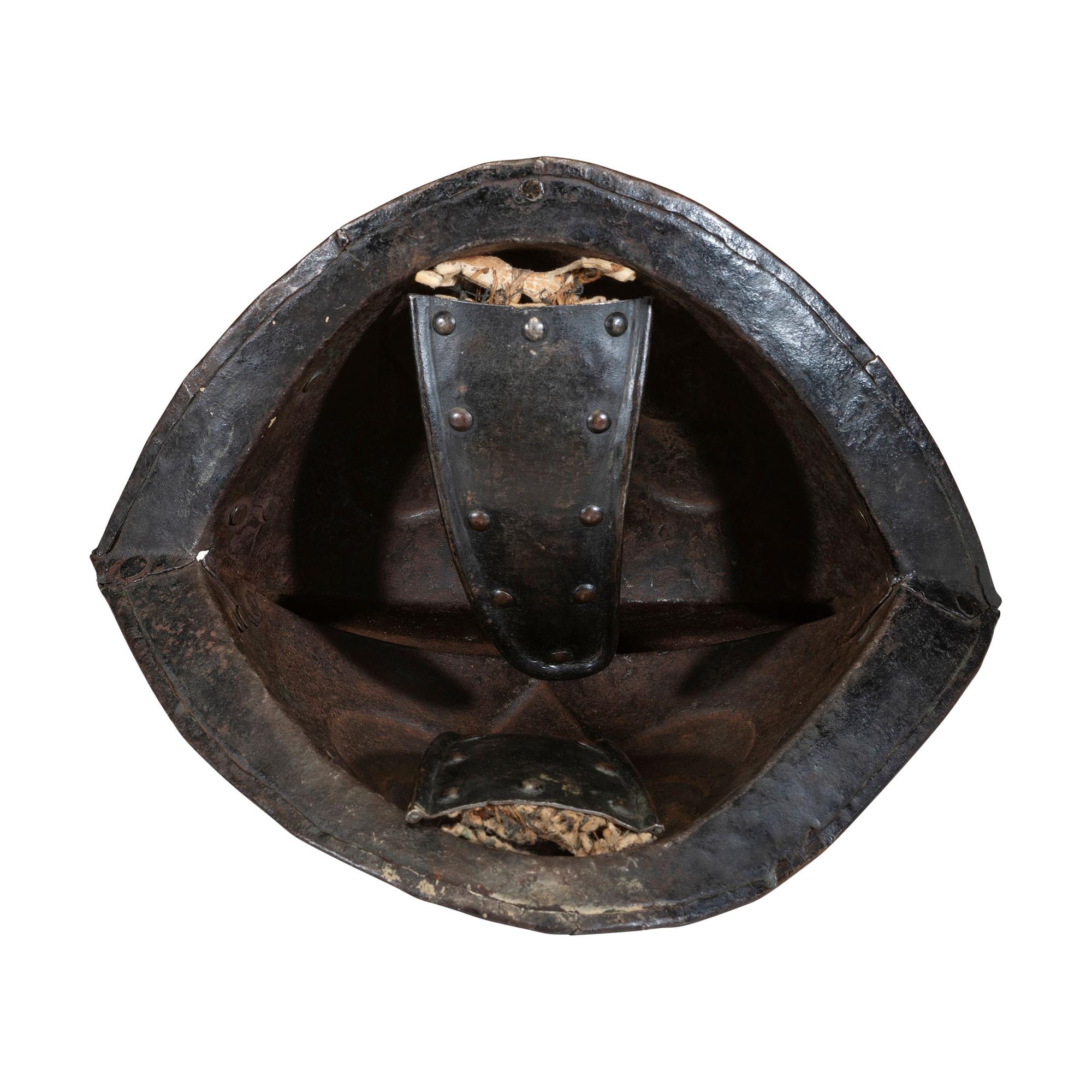 A German Black and White Comb Morian Helmet with Ear Flaps