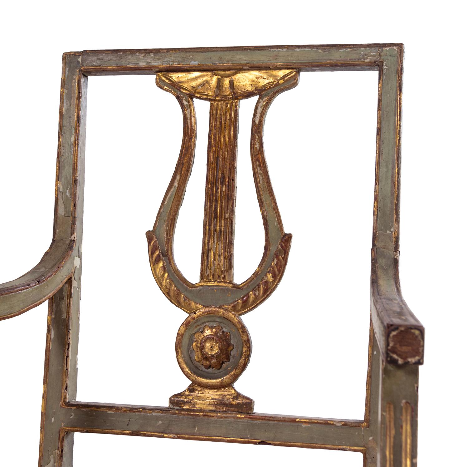A Pair of Italian Painted and Parcel Gilt Lyre-Back Armchairs