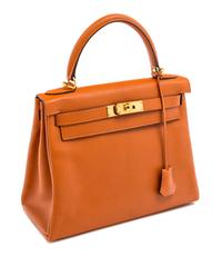 An Hermes Orange Retourne 28cm Kelly Handbag, 11" x 8.5" x 4"; Handle drop: 3.5".