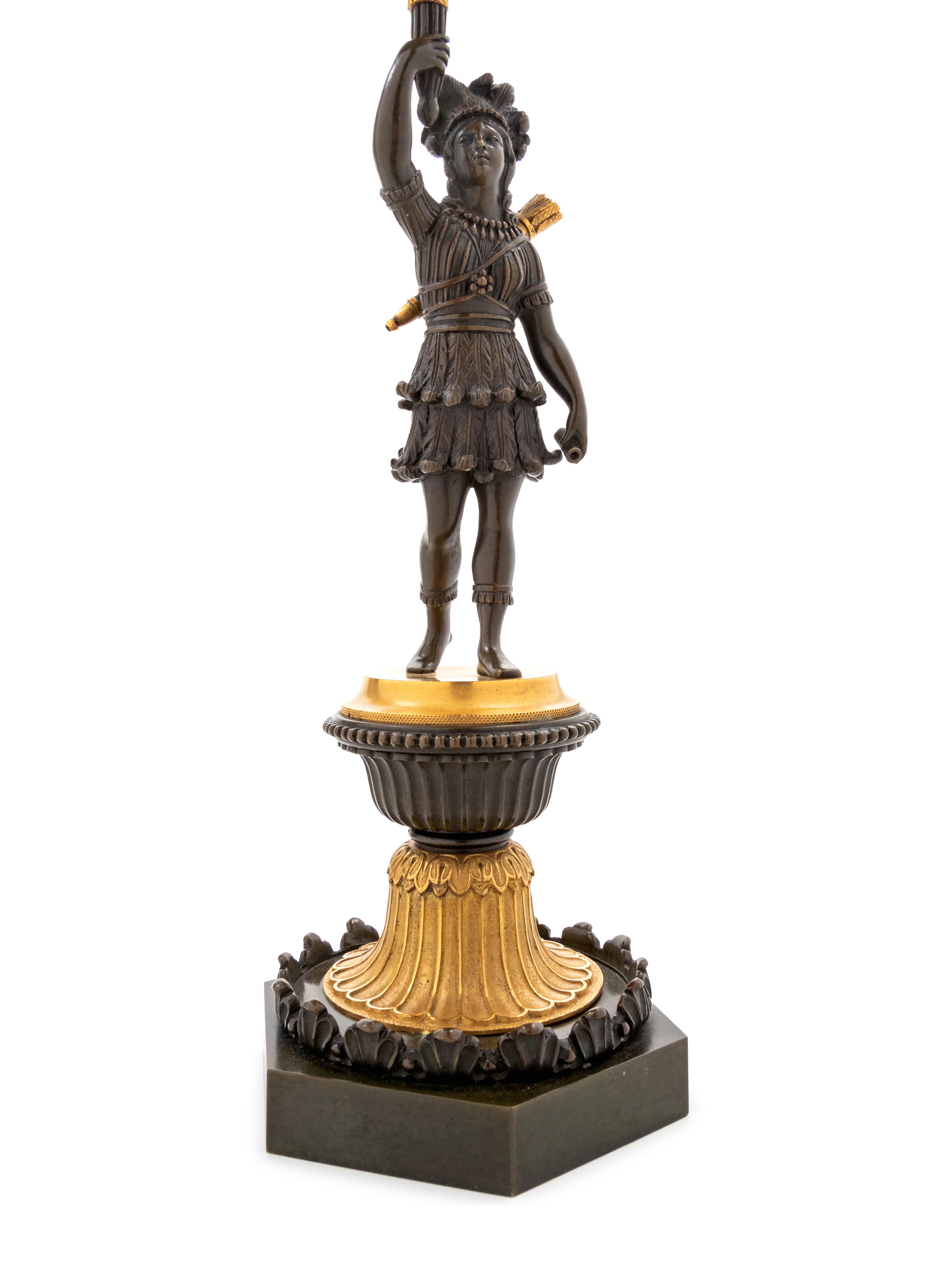 A Pair of Regency Gilt and Patinated Bronze Three-Light Figural Candelabra