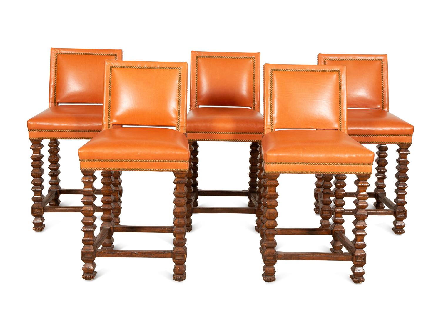 A Set of Five Contemporary Carved Oak and Leather Bar Stools