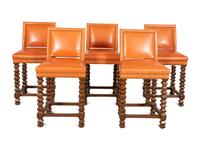 A Set of Five Contemporary Carved Oak and Leather Bar Stools