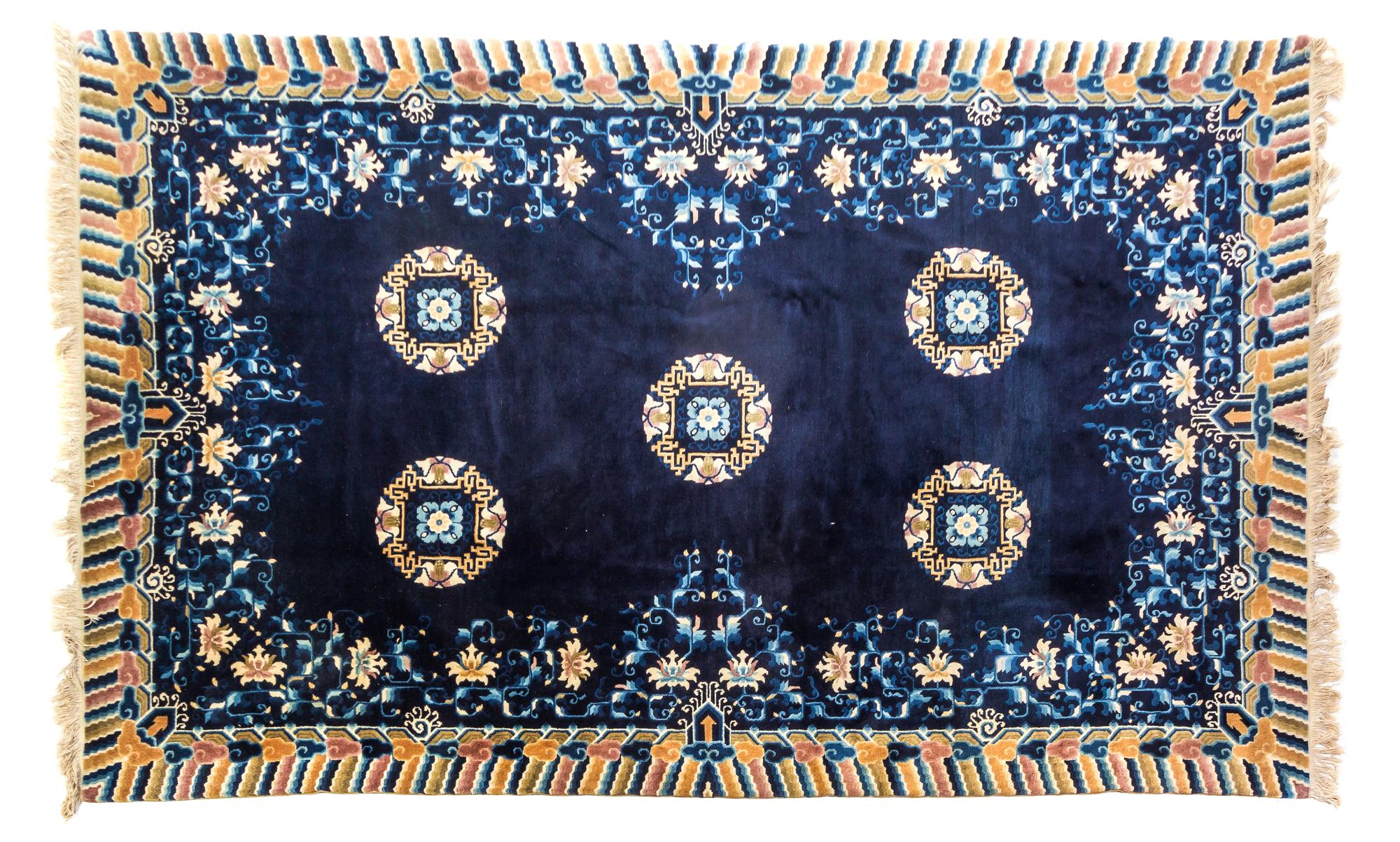 A Chinese Wool Rug 8 feet 1 inch x 5 feet 1 inch.