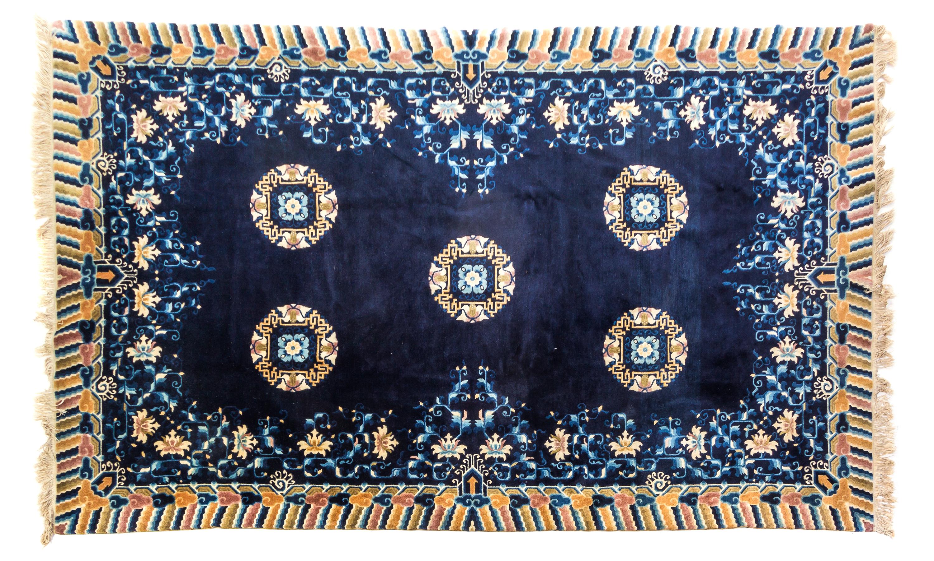 A Chinese Wool Rug 8 feet 1 inch x 5 feet 1 inch.
